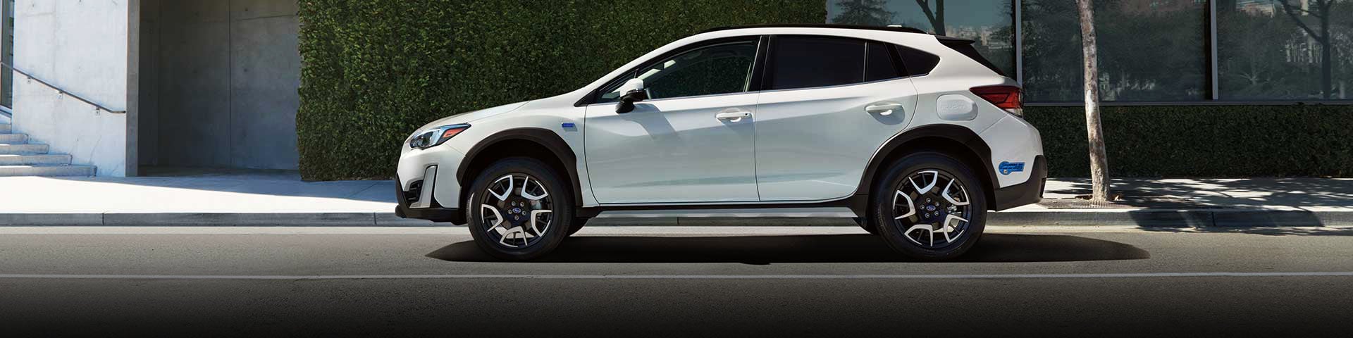 The side profile of a white Subaru Crosstrek Hybrid | River City Subaru in Huntington WV