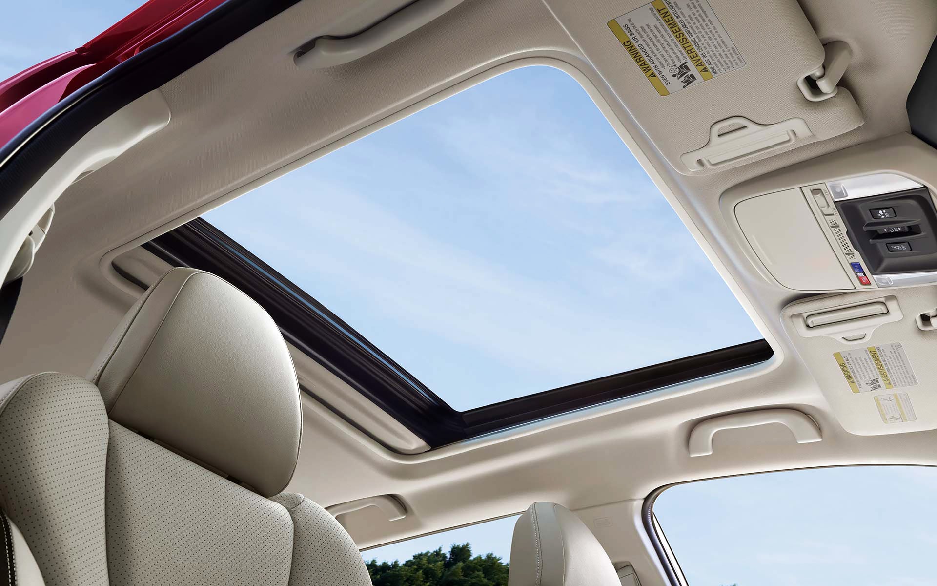 A view through the power sliding panoramic moonroof on the 2022 Forester Sport. | River City Subaru in Huntington WV