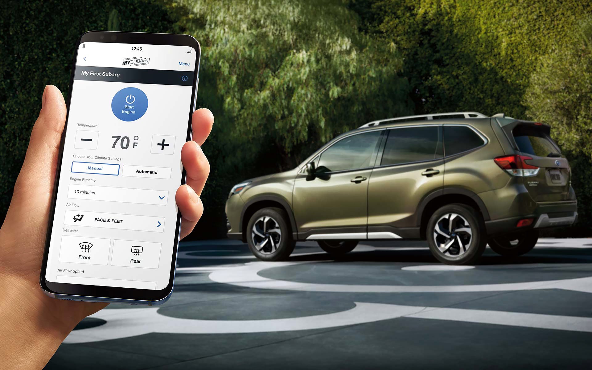 A close-up of a phone showing the Remote Engine Start with Climate Control feature of SUBARU STARLINK® Safety and Security available on the 2022 Forester. | River City Subaru in Huntington WV