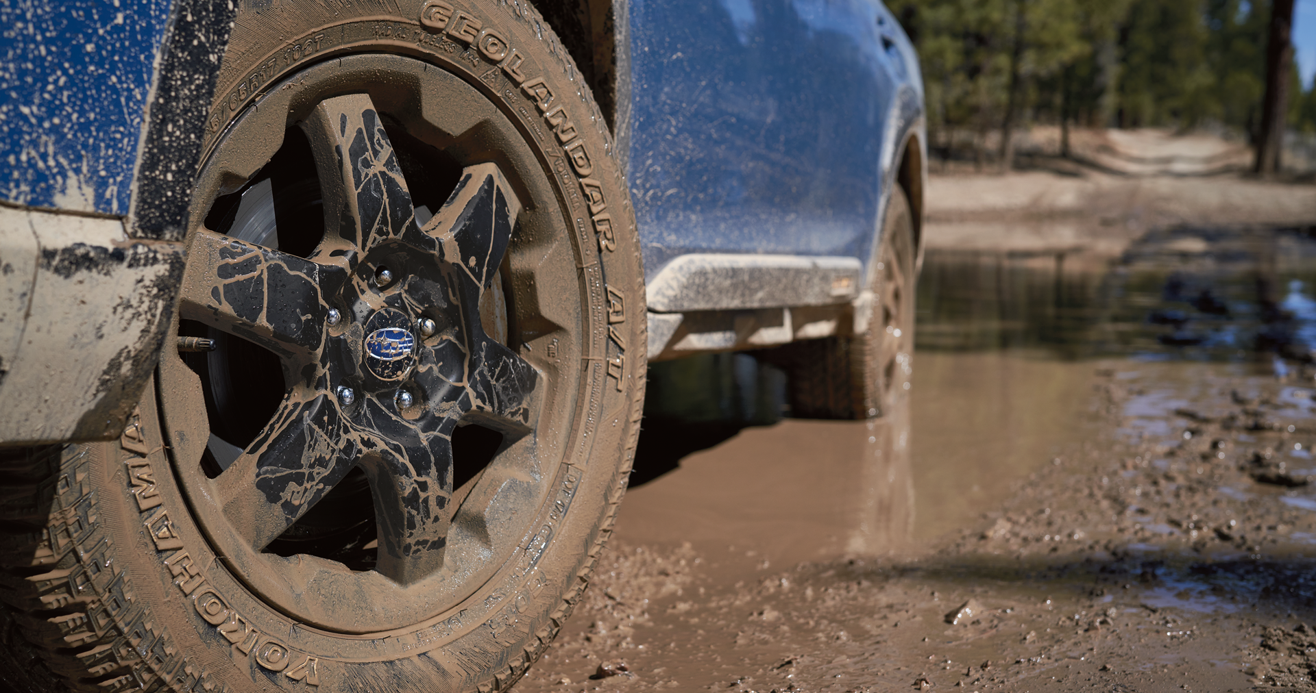 A close-up of the 17-inch off-road wheels and all-terrain Yokohama GEOLANDAR® tires on the 2023 Outback Wilderness. | River City Subaru in Huntington WV