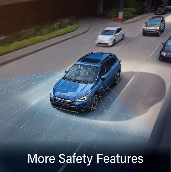 A Subaru Crosstrek in blue with the words &ldquo;More Safety Features&ldquo;. | River City Subaru in Huntington WV